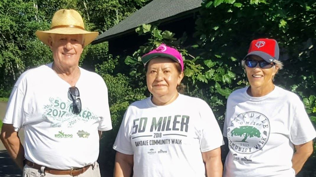 Three Walkers Wearing Reward Tees