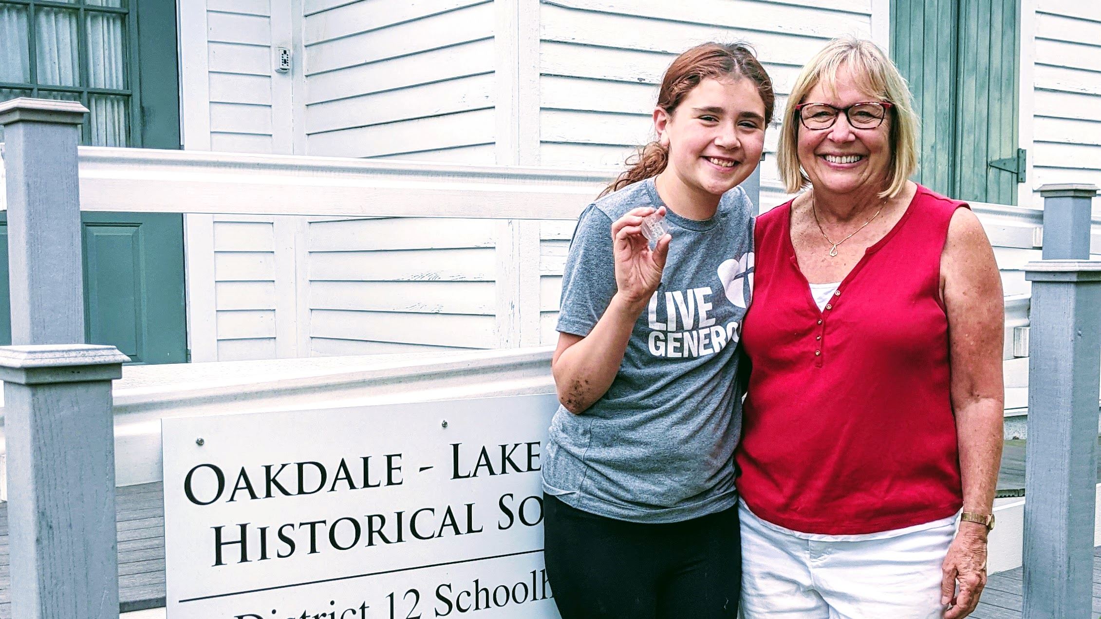 Winners pose with the medallion