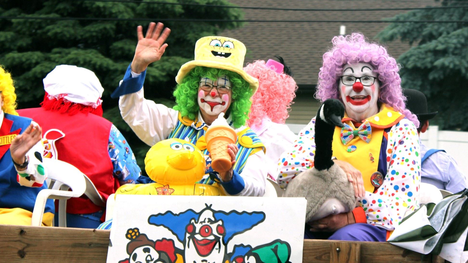 Clowns smile and wave