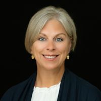 Headshot of Melanie Lee on black background