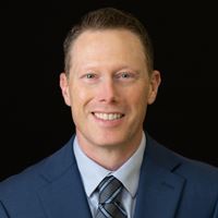 Headshot of Nicholas Newton on black background