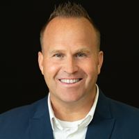 Headshot of Kevin Wold on black background