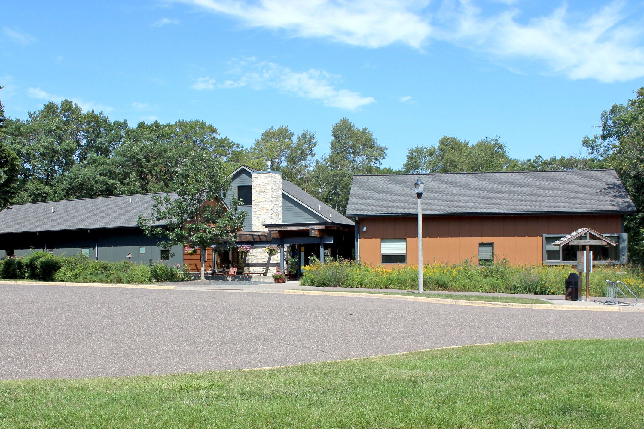 Brown wooden building with steel grey structures