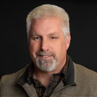 Headshot of person on black background
