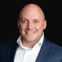 Headshot of person on black background