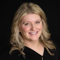 Headshot of person on black background