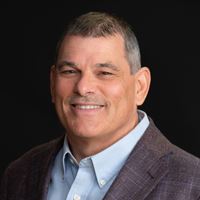 Headshot of person on black background