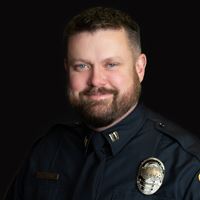 Headshot of person on black background